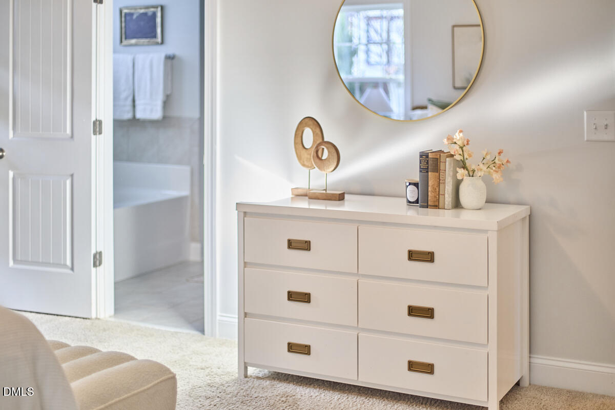 8600 Rowan Oak Court Wake Forest, NC 27587 - Photo 21 of 42 a bathroom with a sink a mirror and a shower