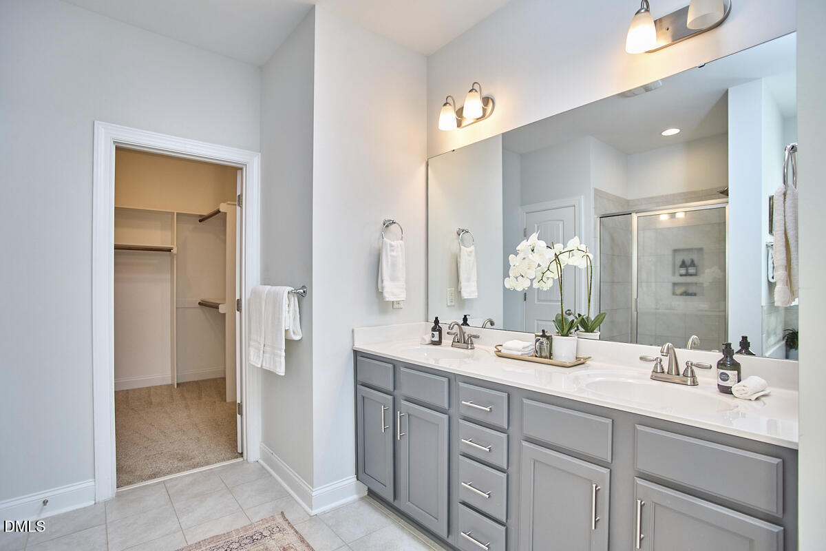 8600 Rowan Oak Court Wake Forest, NC 27587 - Photo 22 of 42 a spacious bathroom with a double vanity sink mirror and double