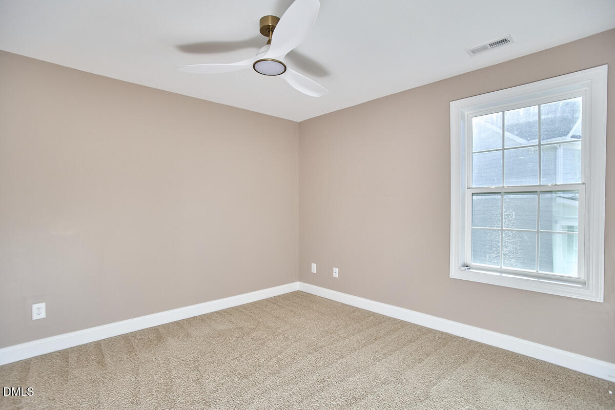 8600 Rowan Oak Court Wake Forest, NC 27587 - Photo 30 of 42 an empty room with a window