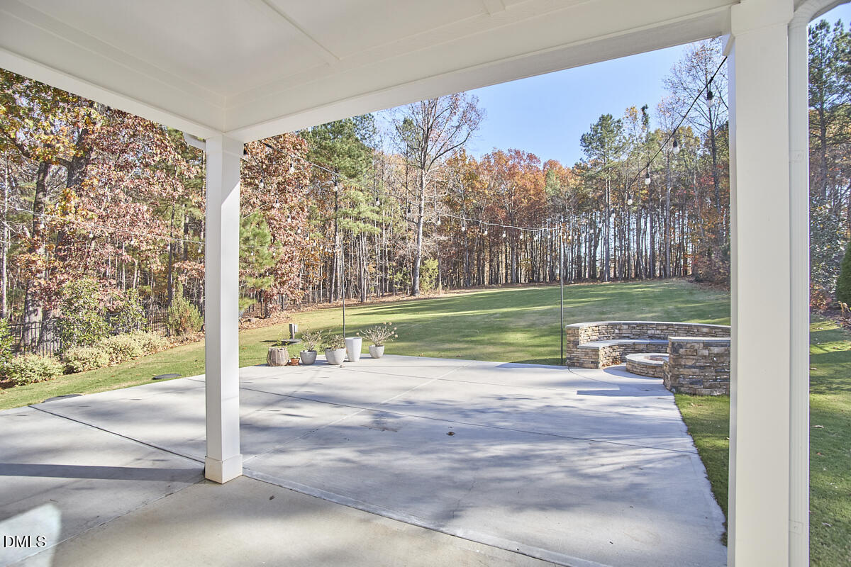 8600 Rowan Oak Court Wake Forest, NC 27587 - Photo 34 of 42 a view of a room with a big yard and potted plants