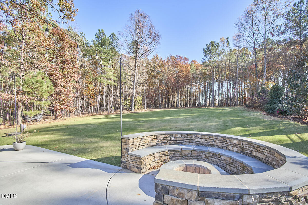 8600 Rowan Oak Court Wake Forest, NC 27587 - Photo 37 of 42 a view of a swimming pool with a yard