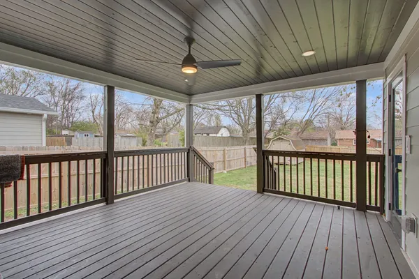 a view of a porch with wooden floor