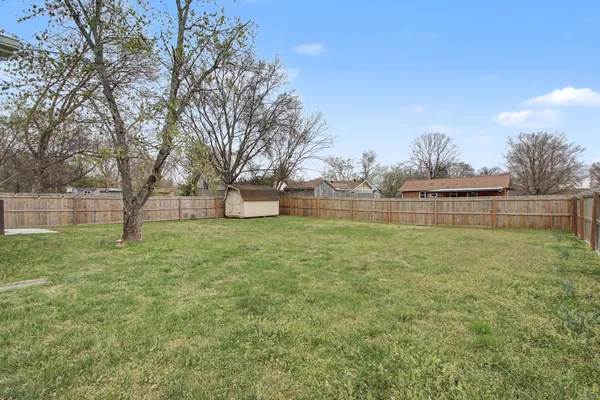 a view of outdoor space with deck and yard