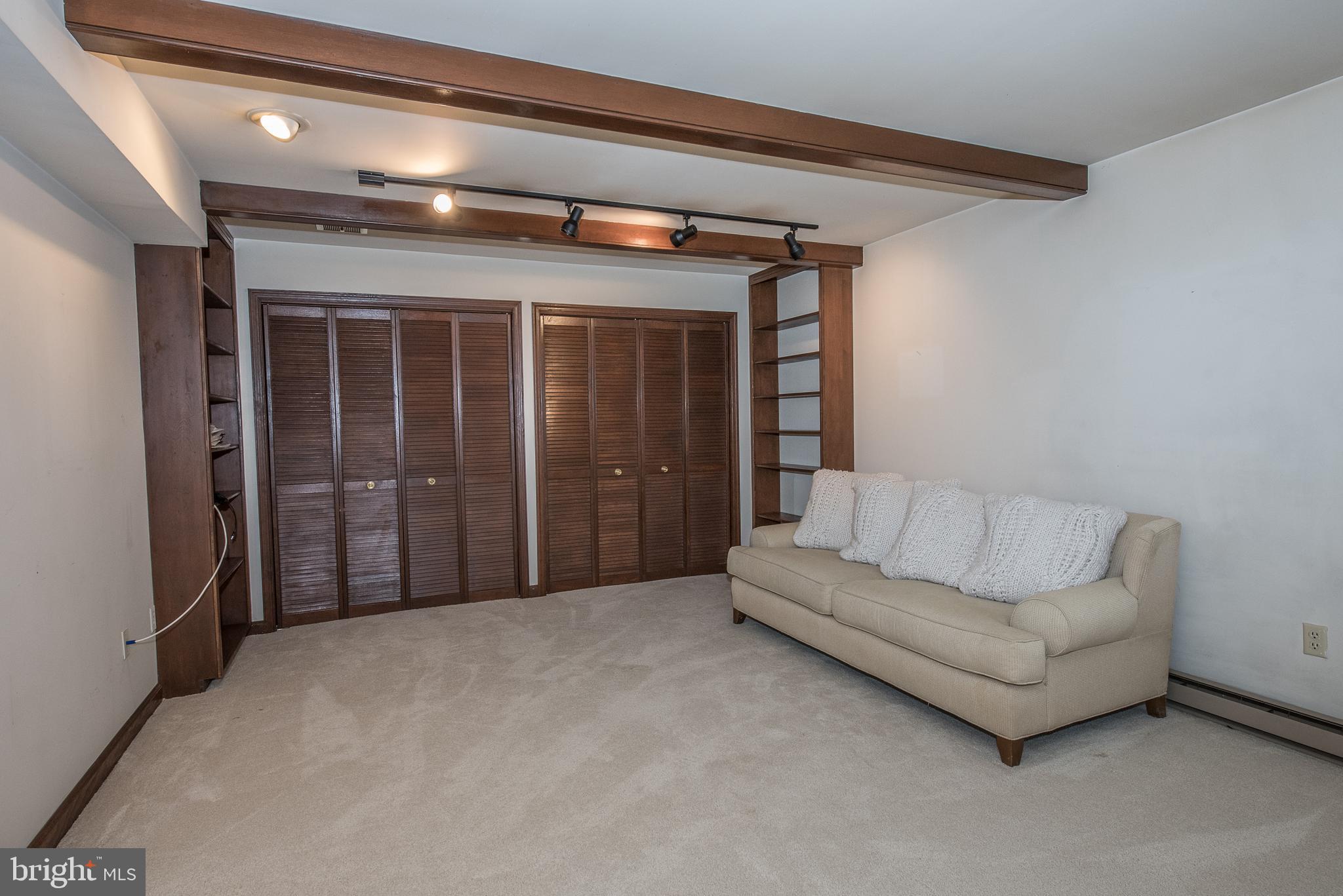 5 Avignon Devon, PA 19333 - Photo 29 of 32 Family room on lower level with built-ins.