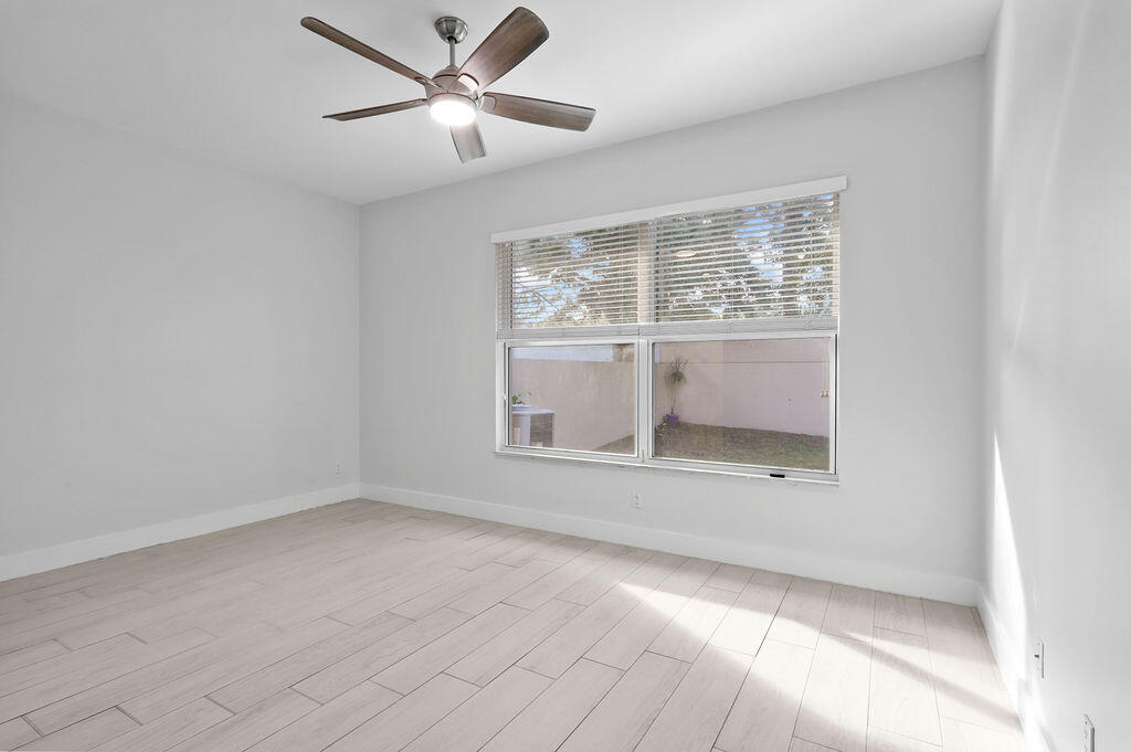 168 South Hampton Drive Jupiter, FL 33458 - Photo 11 of 33 a view of room with a ceiling fan and window