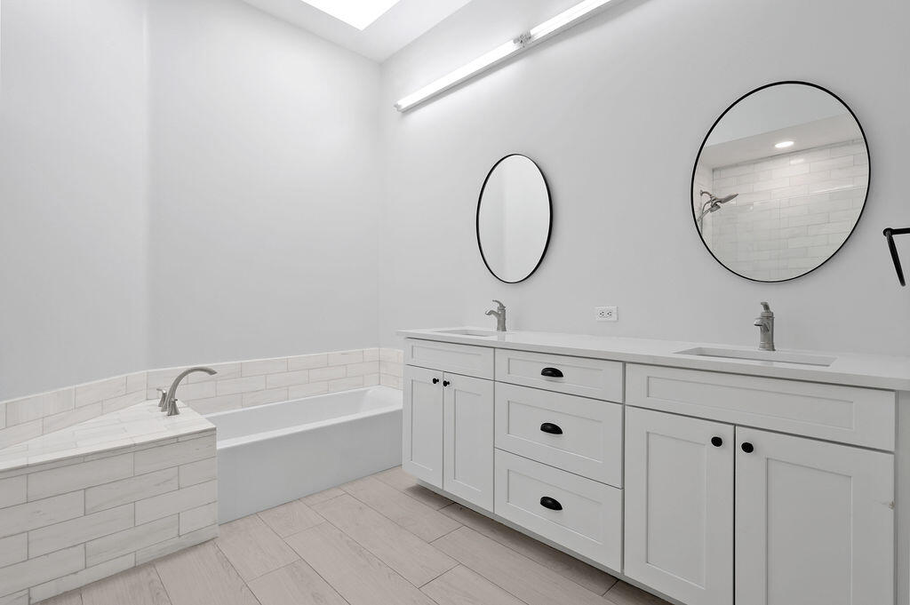 168 South Hampton Drive Jupiter, FL 33458 - Photo 17 of 33 a bathroom with a double vanity sink and a mirror