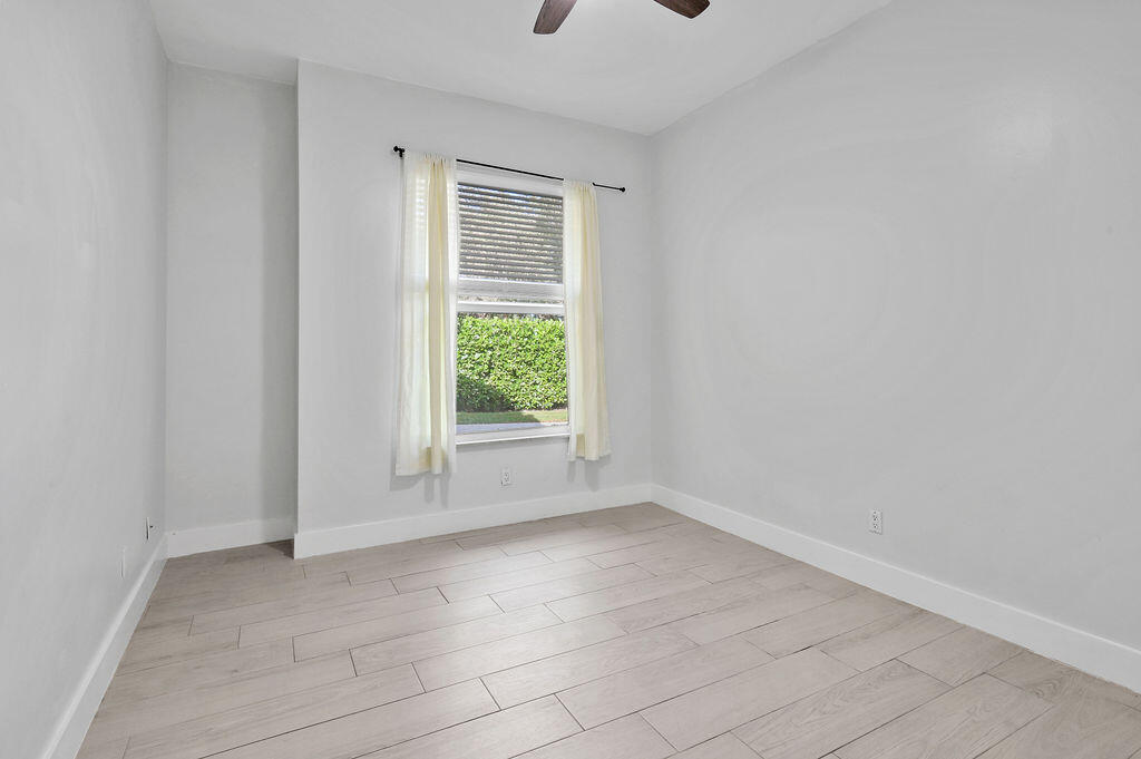 168 South Hampton Drive Jupiter, FL 33458 - Photo 24 of 33 a view of an empty room with a window