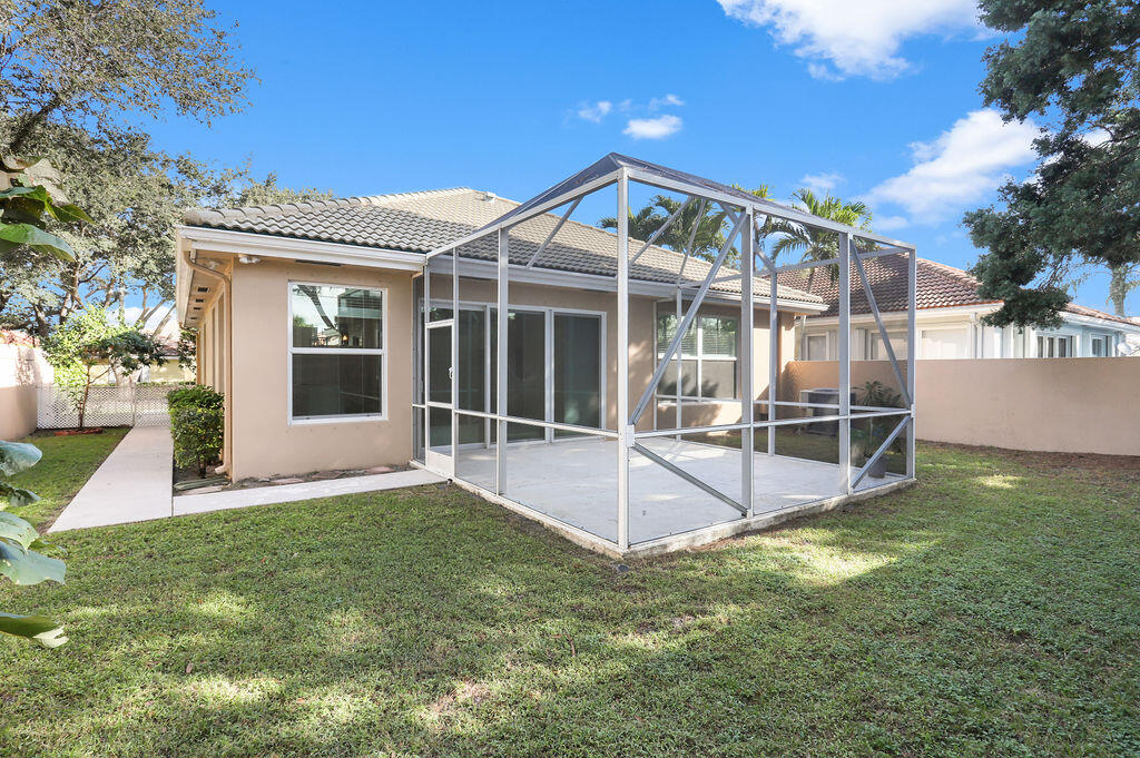 168 South Hampton Drive Jupiter, FL 33458 - Photo 29 of 33 a view of a house with a yard and sitting area