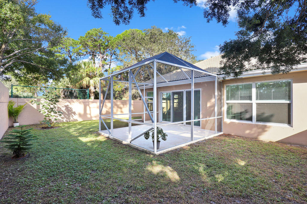168 South Hampton Drive Jupiter, FL 33458 - Photo 31 of 33 a view of a chair and table in backyard of the house