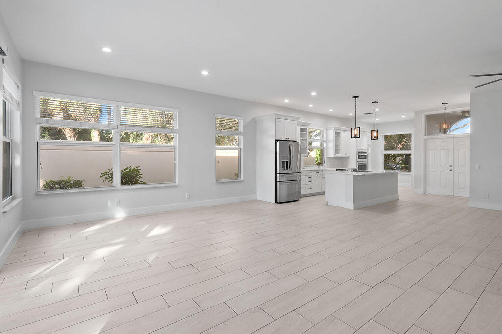 168 South Hampton Drive Jupiter, FL 33458 - Photo 9 of 33 a view of kitchen with refrigerator and window