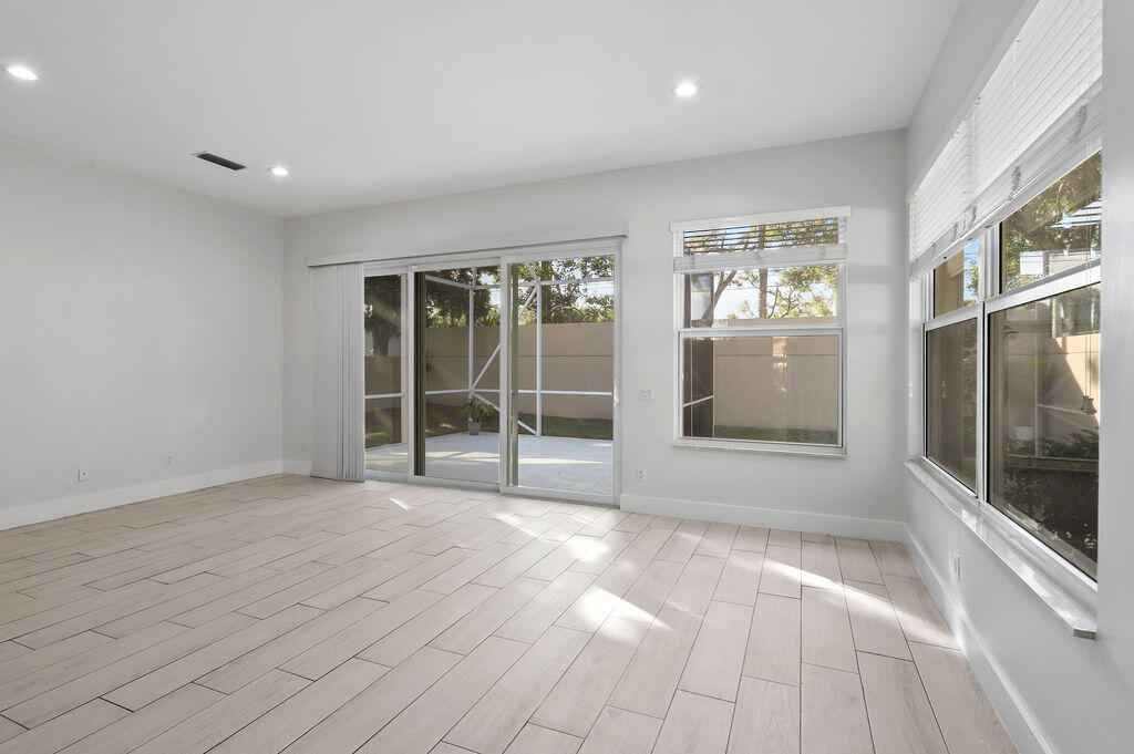 168 South Hampton Drive Jupiter, FL 33458 - Photo 10 of 33 a view of an empty room with glass door