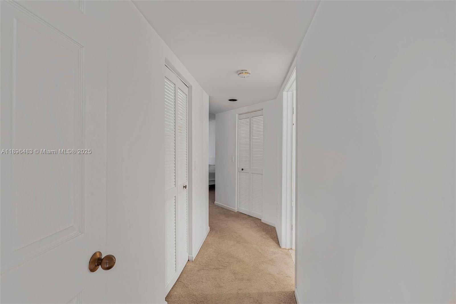 7507 La Paz Boulevard, Unit 407 Boca Raton, FL 33433 - Photo 17 of 34 a view of a hallway