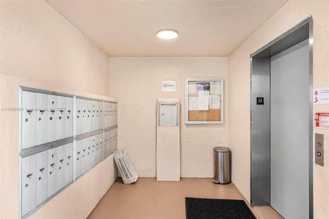 an aerial view of residential houses with outdoor space and lake view