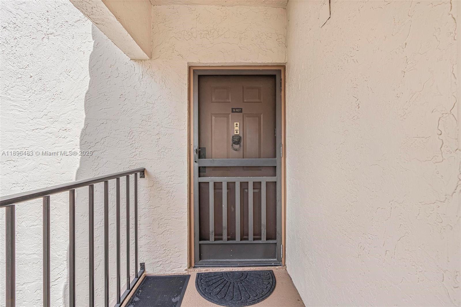 7507 La Paz Boulevard, Unit 407 Boca Raton, FL 33433 - Photo 3 of 34 a view of front door
