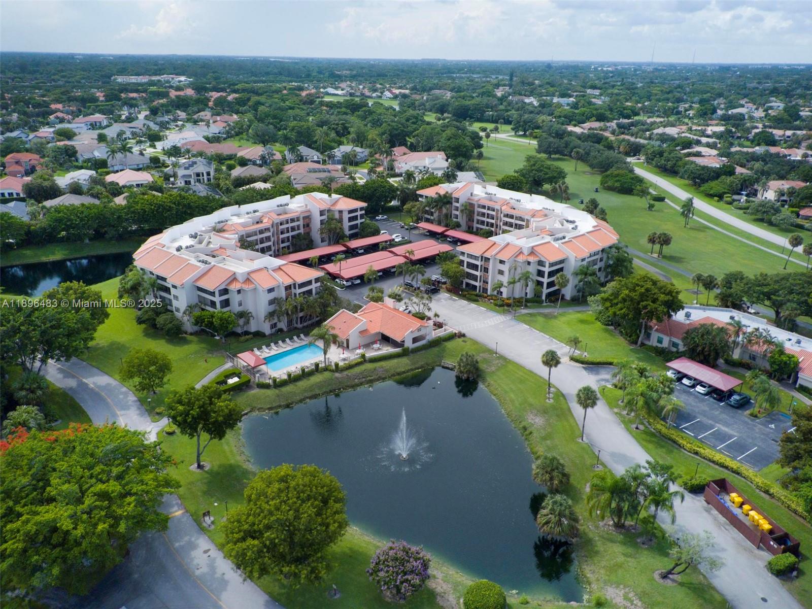 7507 La Paz Boulevard, Unit 407 Boca Raton, FL 33433 - Photo 31 of 34 an aerial view of city and lake