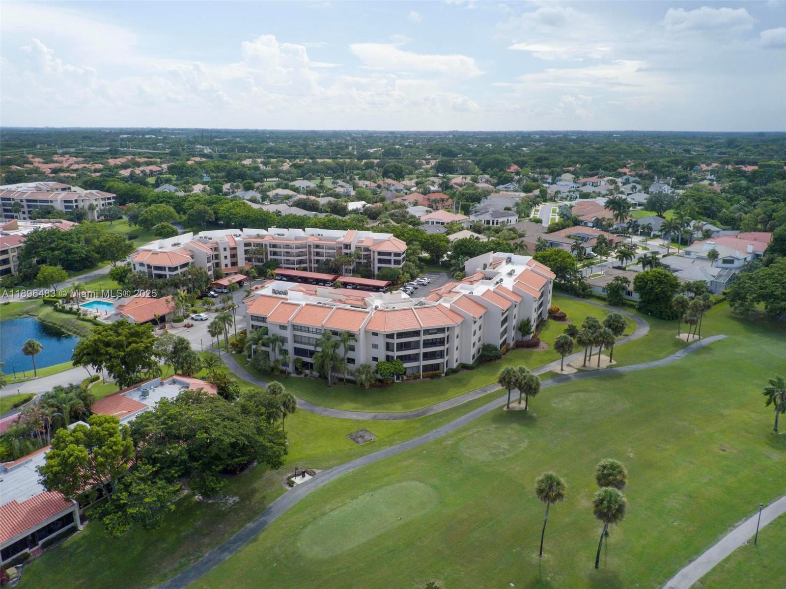 7507 La Paz Boulevard, Unit 407 Boca Raton, FL 33433 - Photo 32 of 34 an aerial view of a house with a garden