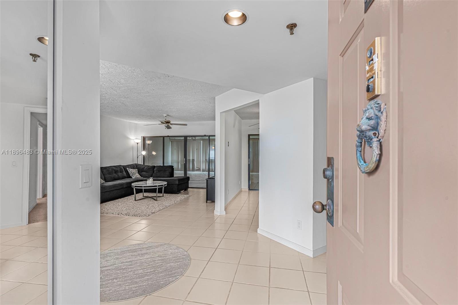 7507 La Paz Boulevard, Unit 407 Boca Raton, FL 33433 - Photo 4 of 34 a view of living room with furniture and window
