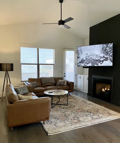 a living room with furniture and a fireplace