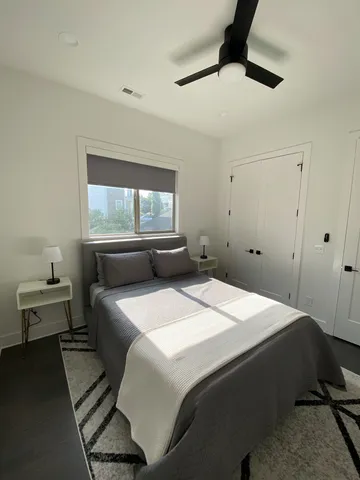 a bedroom with a bed and window