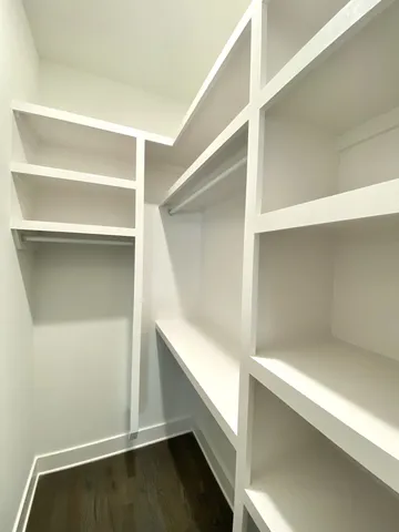 a view of an empty walk in closet