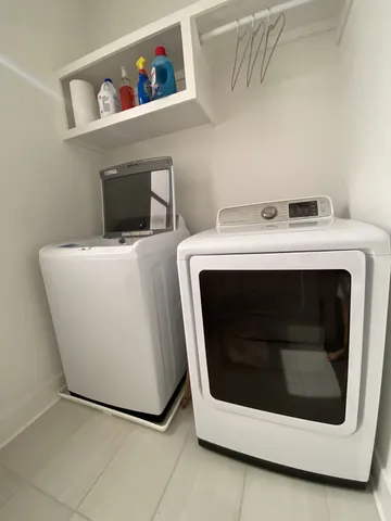a utility room with dryer and washer