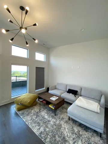 a living room with couch and a flat screen tv