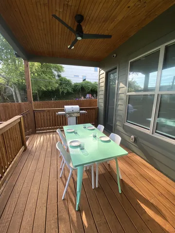 a view of a patio with wooden floor