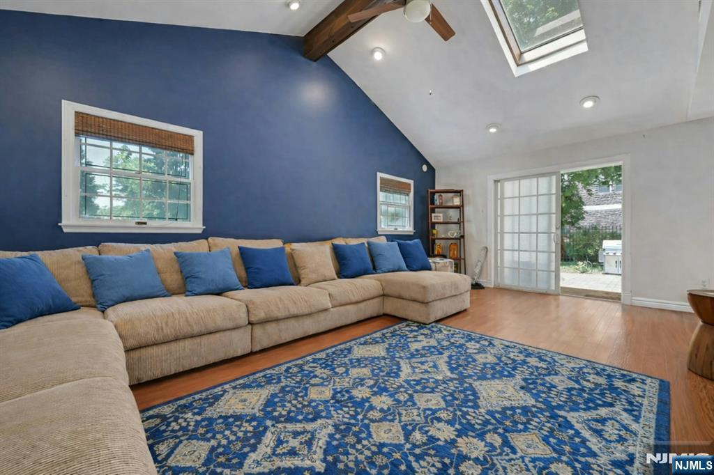 44 West Midland Avenue Paramus, NJ 07652 - Photo 11 of 19 a living room with a couch and a window