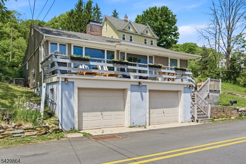 77 Lower North Shore Road Branchville, NJ 07826 - Photo 2 of 38 a front view of a house with garage