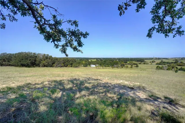 a view of a lake with a yard