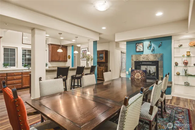 a view of a dining room with furniture window and wooden floor