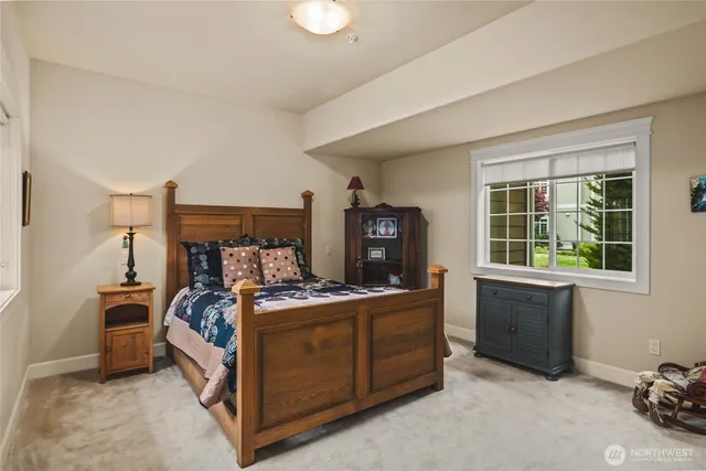 a bed room with a bed and a window