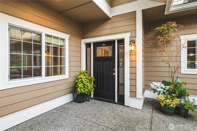 a view of front door of house with potted plant
