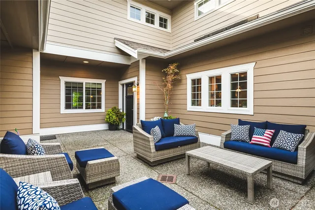 a outdoor living space with furniture and a potted plant