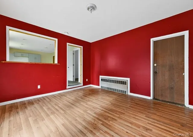 a view of a livingroom with wooden floor