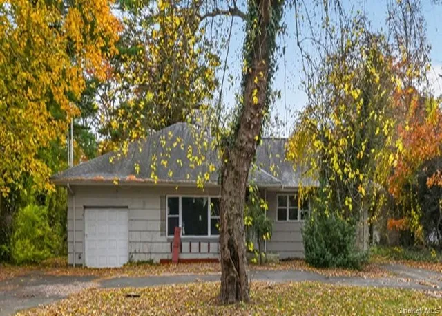 a front view of a house with yard