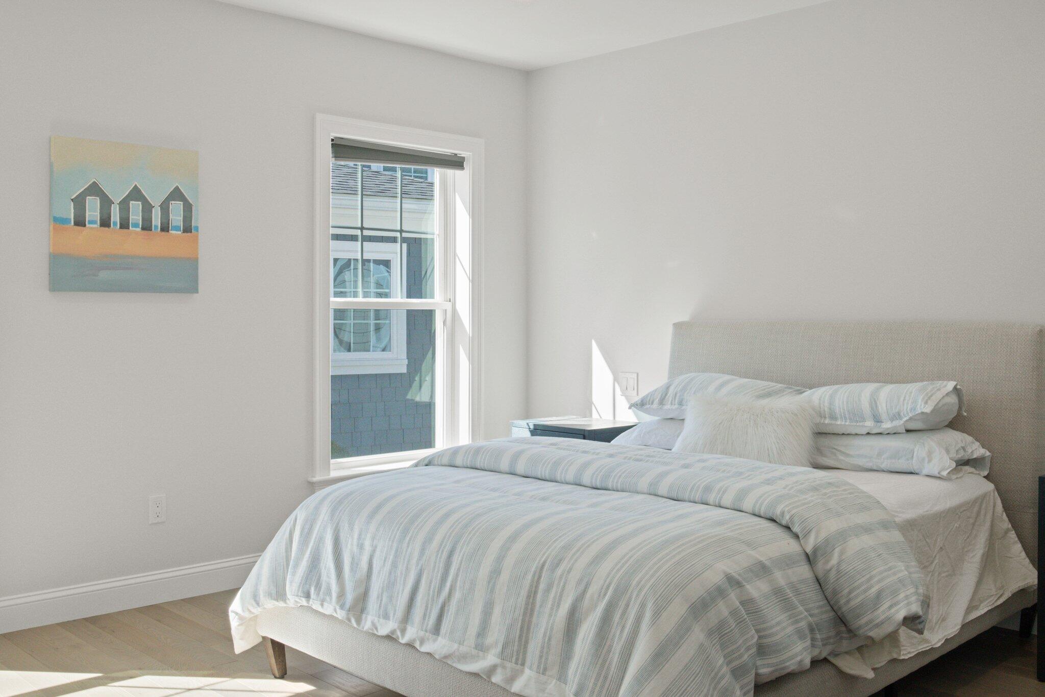 85 Cobblestone Circle Mashpee, MA 02649 - Photo 17 of 42 a bedroom with a bed and a window