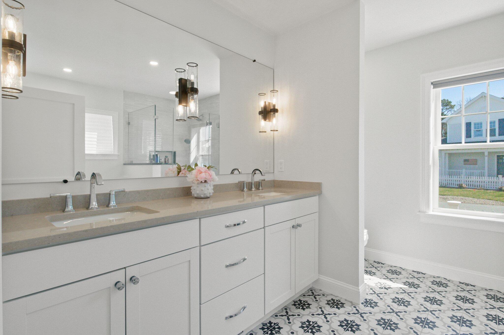 85 Cobblestone Circle Mashpee, MA 02649 - Photo 21 of 42 a bathroom with a double vanity sink and a mirror