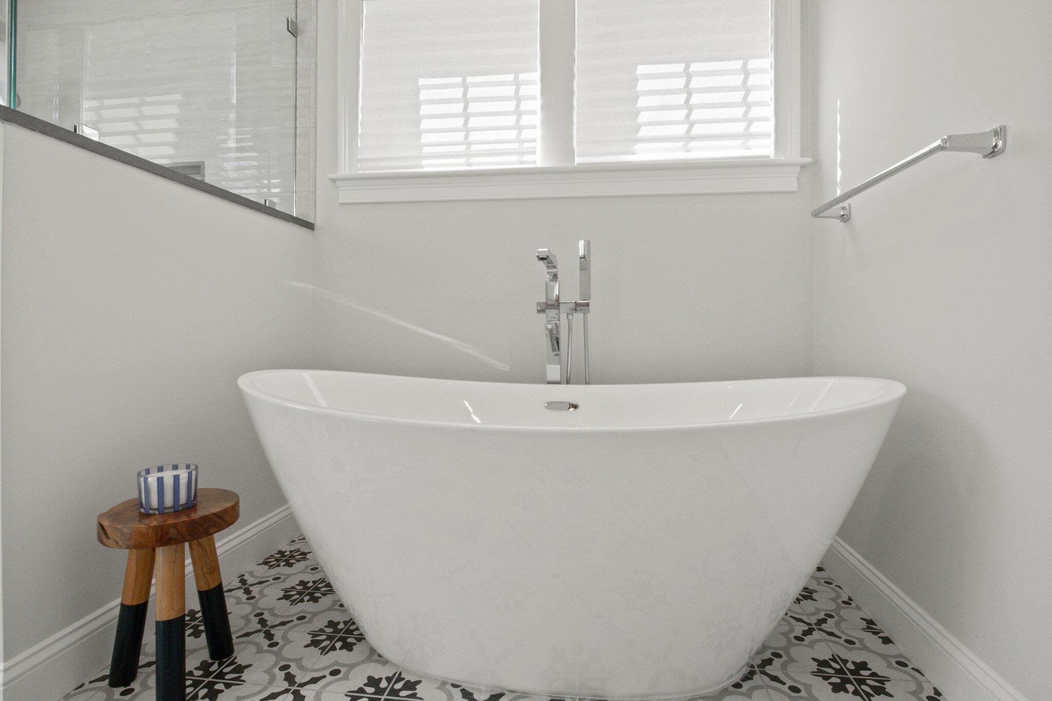 85 Cobblestone Circle Mashpee, MA 02649 - Photo 22 of 42 a white bath tub sitting in a bathroom next to a window