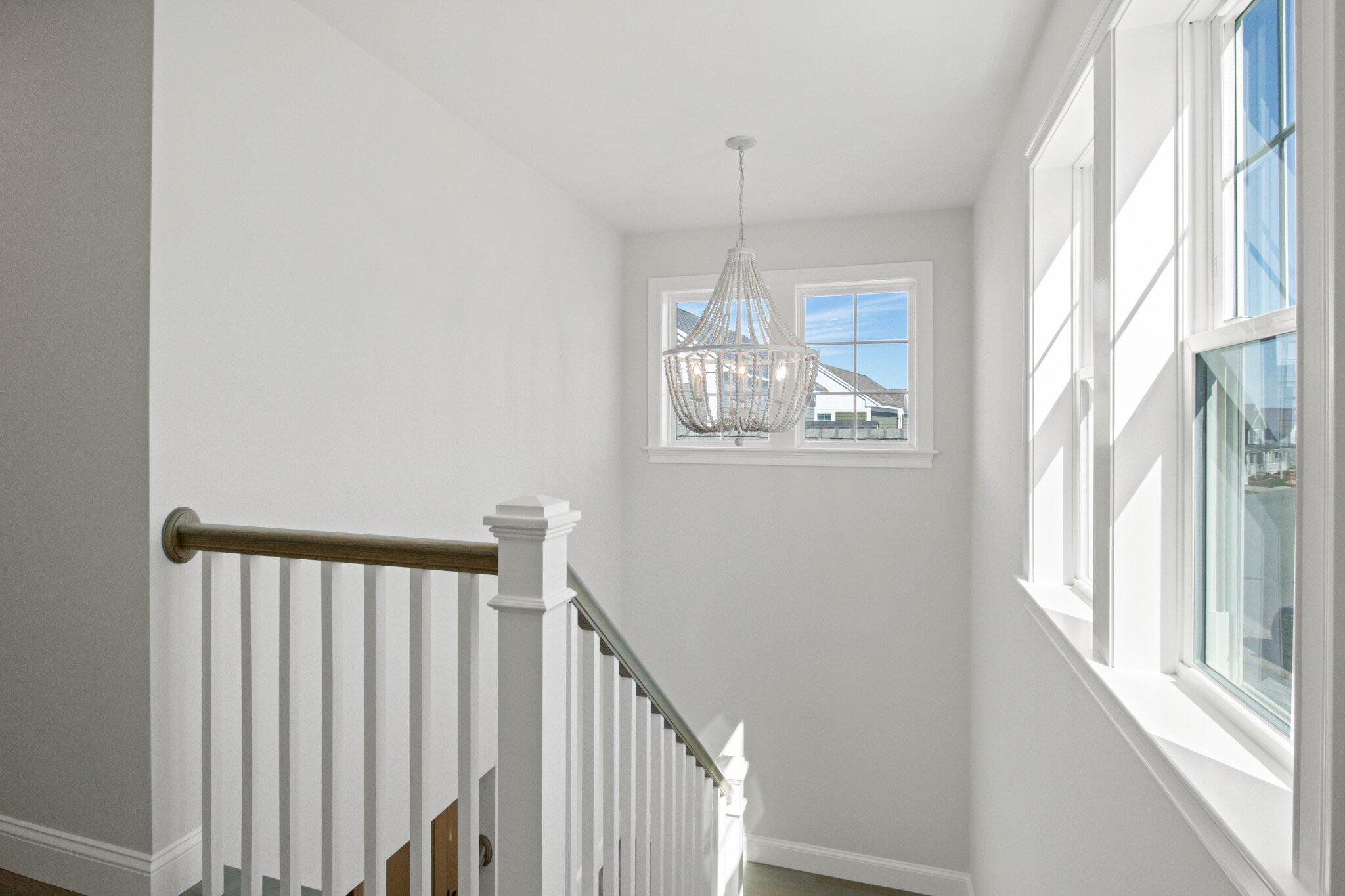 85 Cobblestone Circle Mashpee, MA 02649 - Photo 23 of 42 a view of a hallway with windows