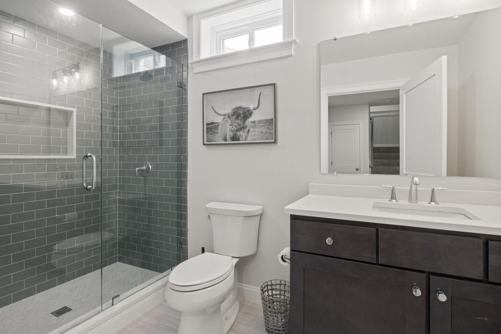 85 Cobblestone Circle Mashpee, MA 02649 - Photo 29 of 42 a bathroom with a sink a toilet and shower