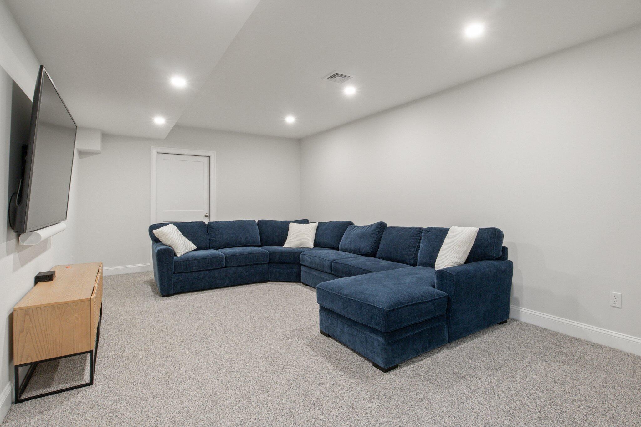 85 Cobblestone Circle Mashpee, MA 02649 - Photo 30 of 42 a living room with furniture and a flat screen tv