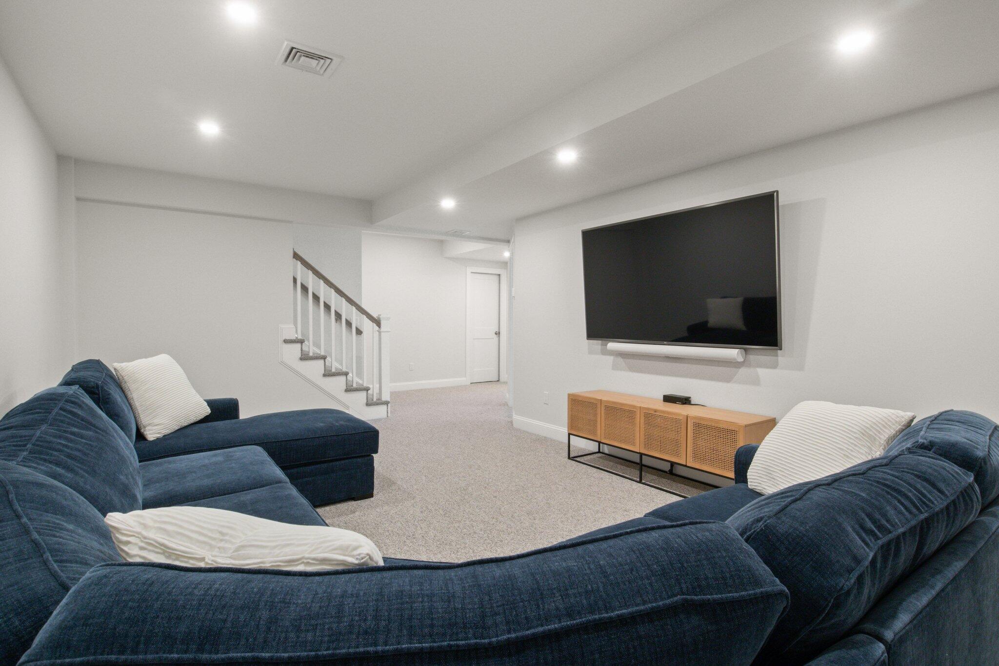 85 Cobblestone Circle Mashpee, MA 02649 - Photo 32 of 42 a living room with furniture and a flat screen tv