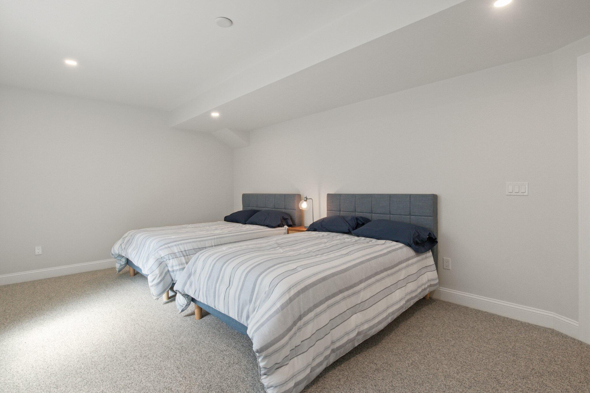 85 Cobblestone Circle Mashpee, MA 02649 - Photo 33 of 42 a bedroom with bed and a night stand