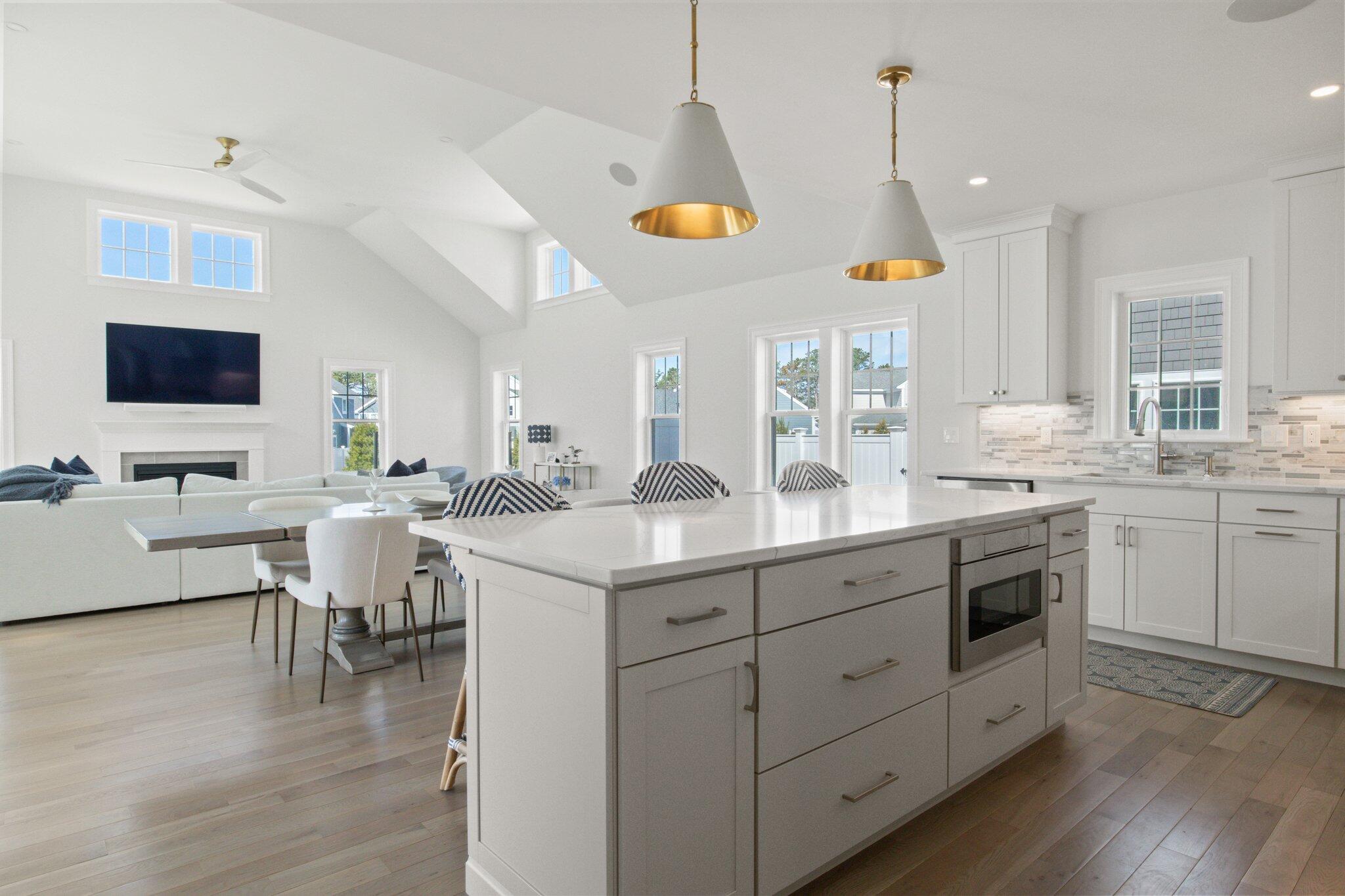 85 Cobblestone Circle Mashpee, MA 02649 - Photo 5 of 42 a kitchen with a sink cabinets and wooden floor