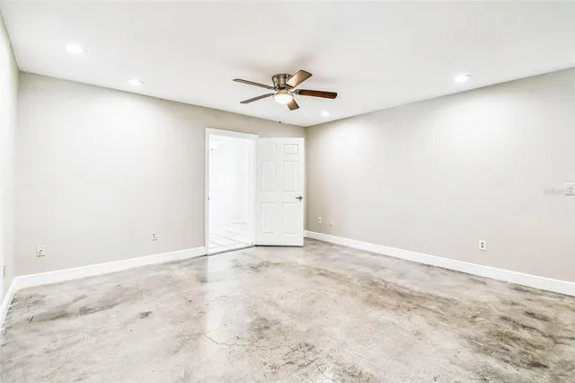 a kitchen with stainless steel appliances granite countertop a sink stove refrigerator and cabinets