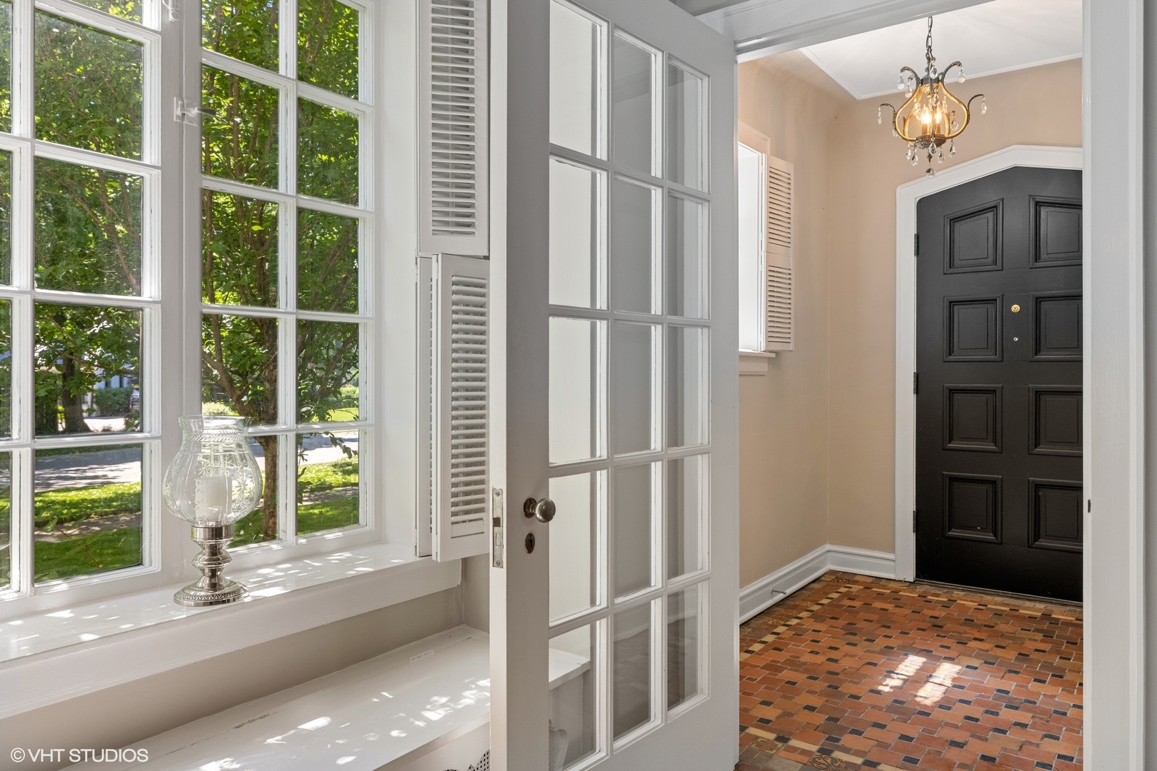 474 Ash Street Winnetka, IL 60093 - Photo 3 of 57 a view of a bedroom with wooden floor and windows