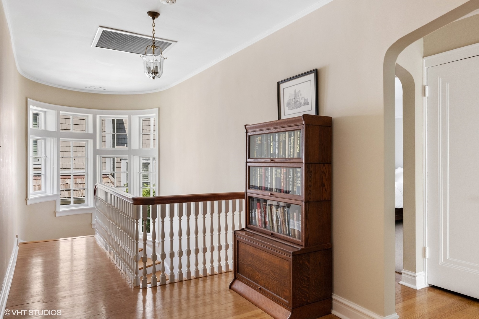 474 Ash Street Winnetka, IL 60093 - Photo 24 of 57 a view of a hallway with wooden floor and windows