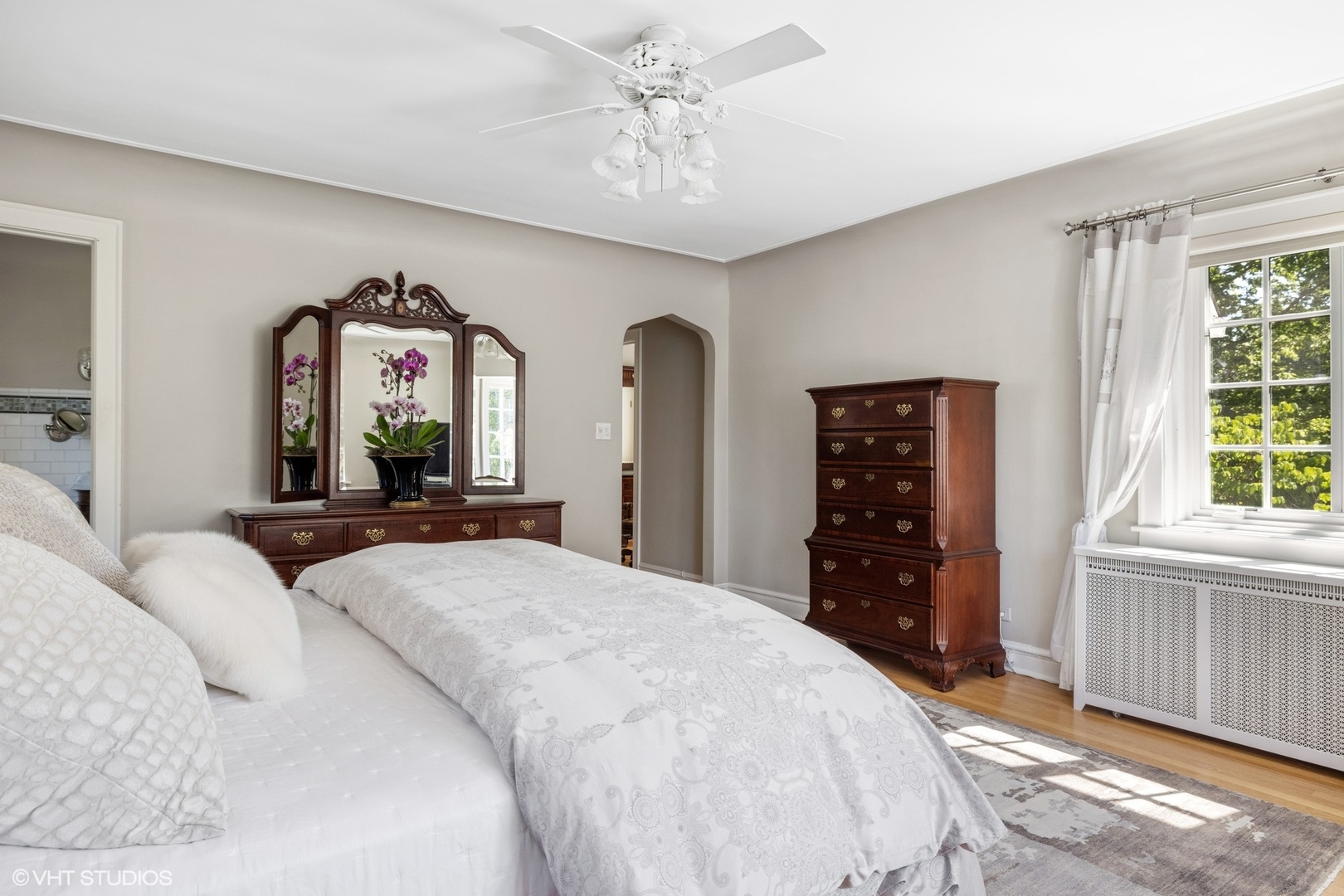 474 Ash Street Winnetka, IL 60093 - Photo 27 of 57 a bedroom with a large bed and a flat tv screen on dresser
