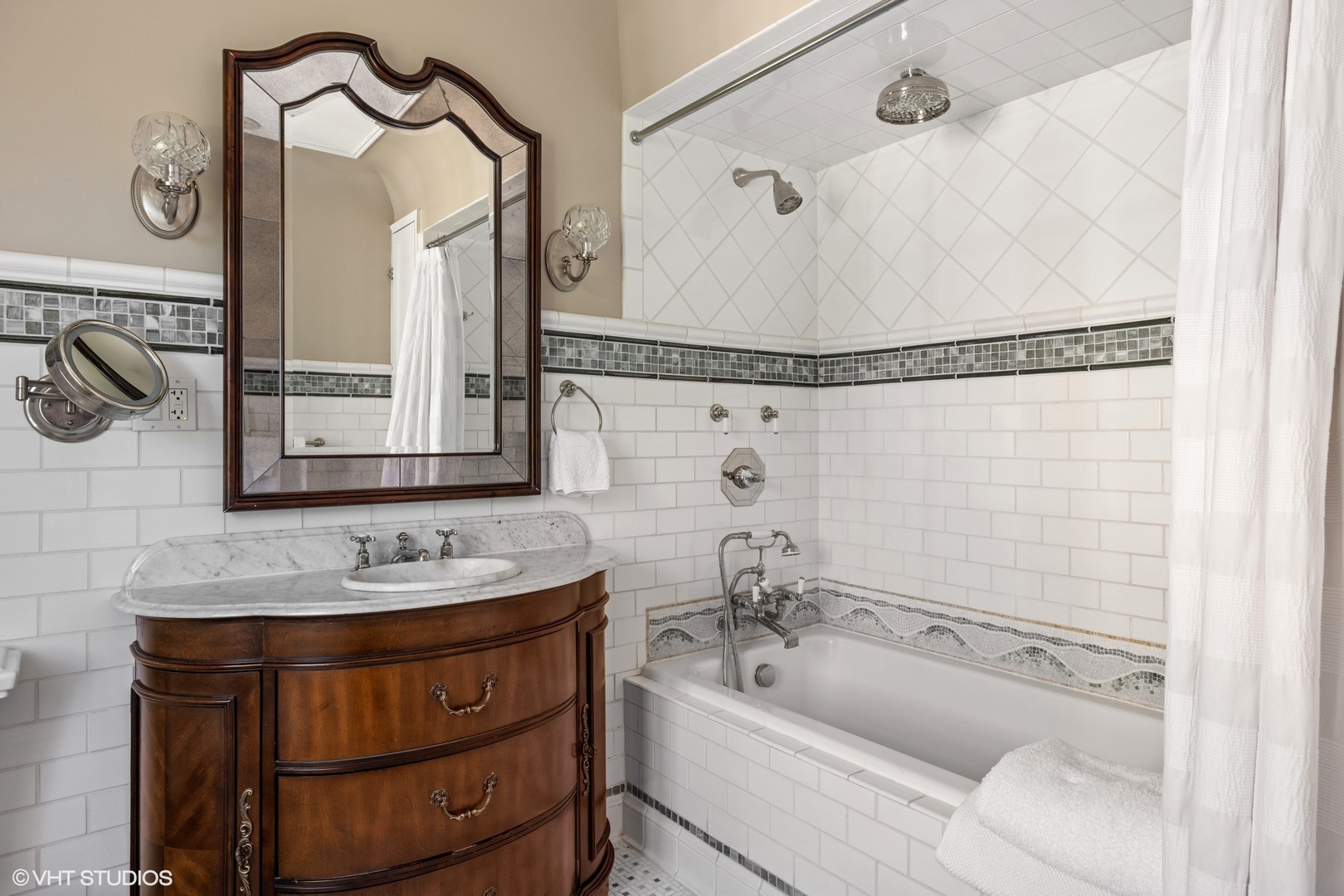 474 Ash Street Winnetka, IL 60093 - Photo 28 of 57 a bathroom with a tub sink and mirror